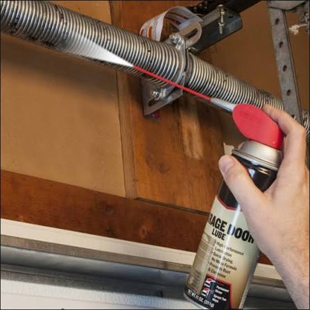 Garage door tune-up and lubrication maintenance
